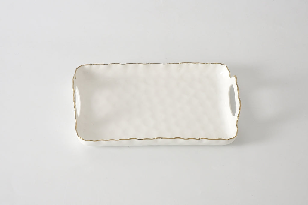 Rectangular ceramic tray with handles on a light gray background