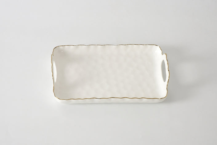 Rectangular ceramic tray with handles on a light gray background
